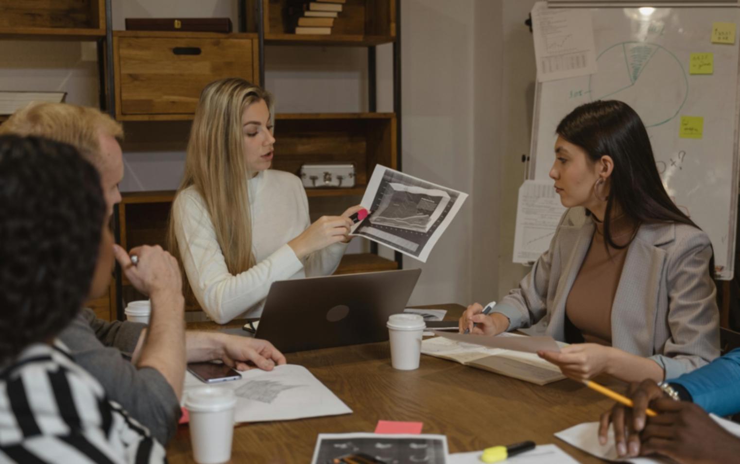 Brand strategy session with client reviewing positioning materials